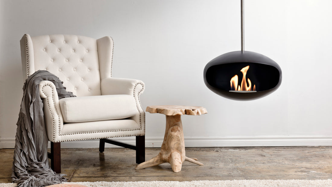 Cocoon Aeris black suspended bioethanol fireplace in modern interior
