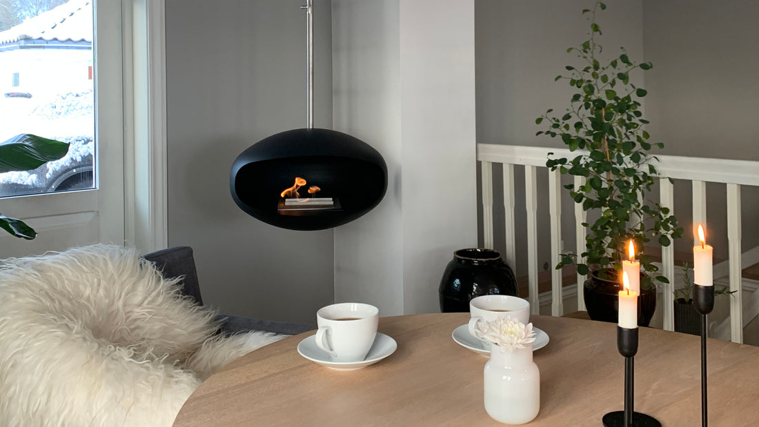 Cocoon Aeris black hanging fireplace in modern living space
