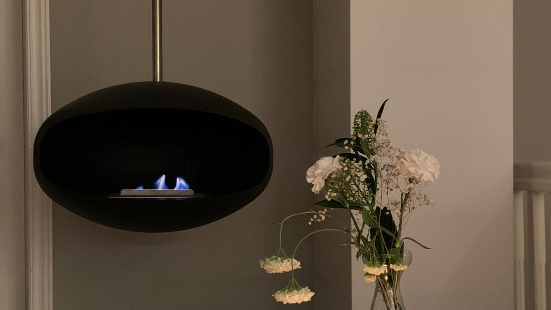 Cocoon Aeris black suspended bioethanol fire in contemporary home