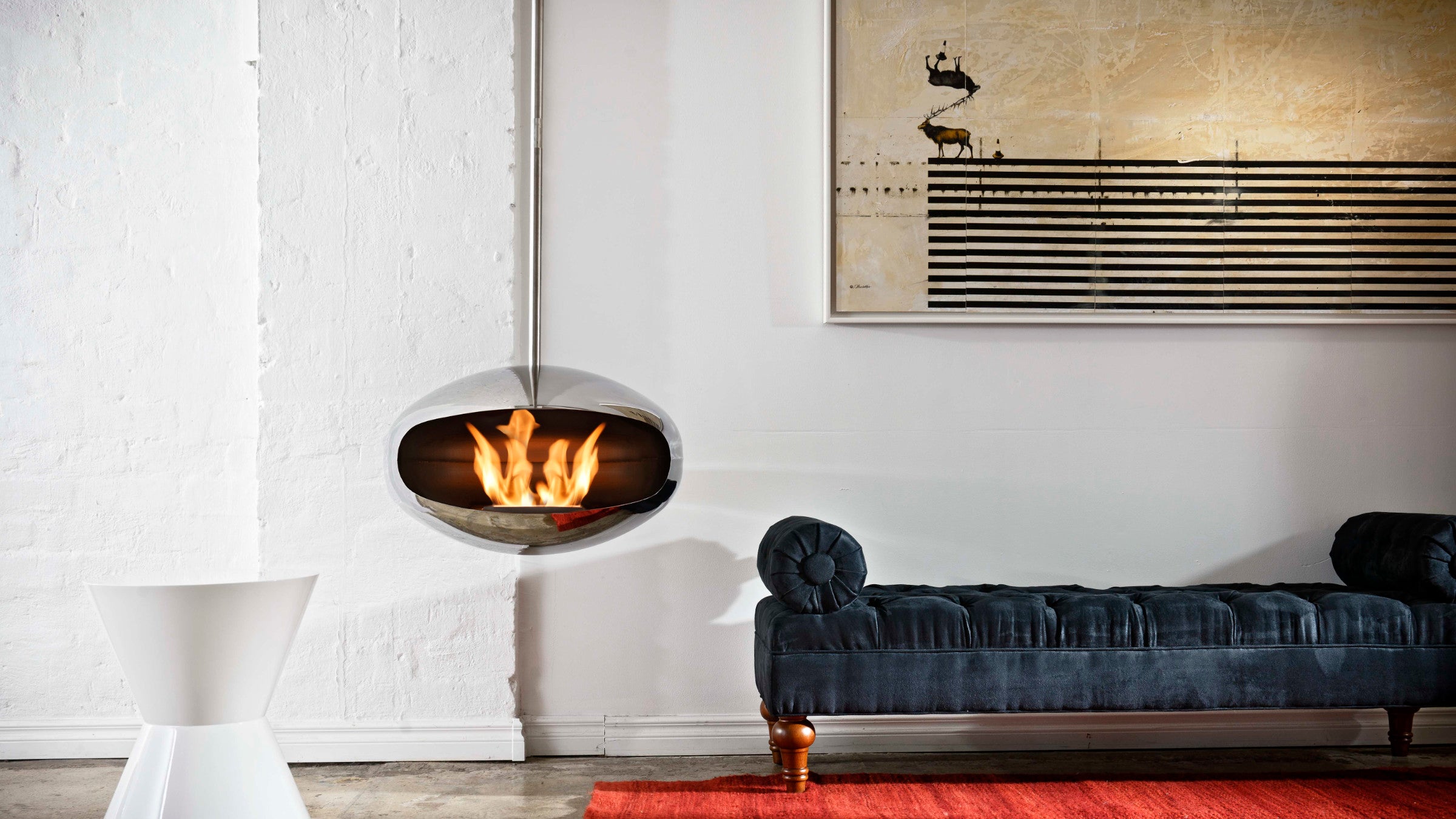 Cocoon Aeris stainless steel suspended fireplace in contemporary interior