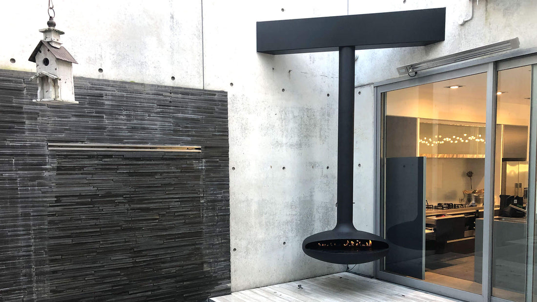 Curve 120 black suspended fireplace in architectural home