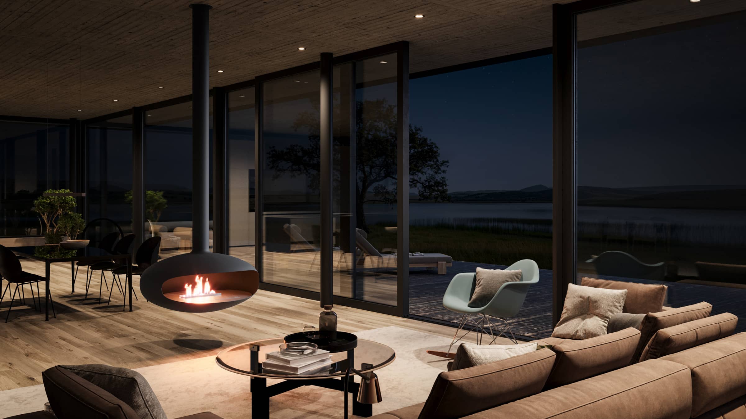 Modern outdoor living space with a Iconic suspended fire and large windows at night.