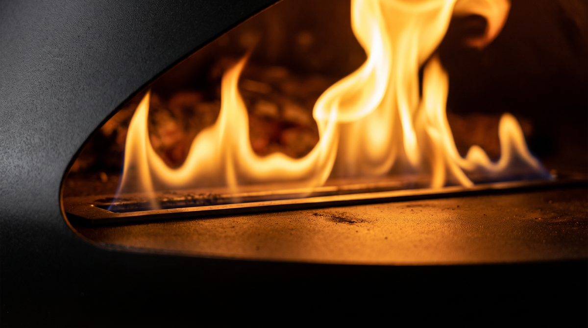Close-up of the flame inside a black steel suspended fire